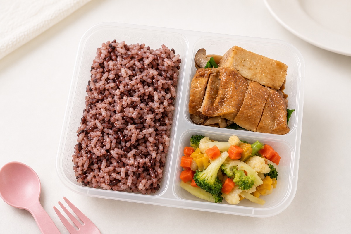 Rice, tofu, mushrooms, and mixed vegetables in a My Little Boss meal tray